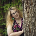 Emma posing with tree